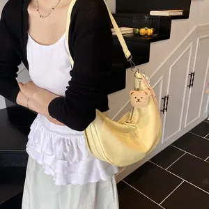 Chic cream yellow crocodile pattern shoulder bag with cute bear charm and long strap