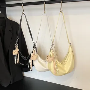 Minimalist faux crocodile leather half-moon bags in black, white, and yellow colors