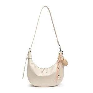 Chic cream crocodile pattern hobo shoulder bag with dual zipper and plush charm
