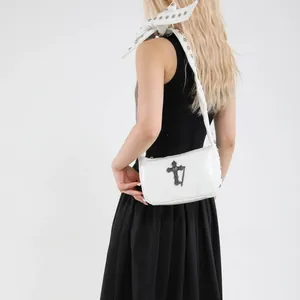 White faux leather crossbody bag with gothic cross rivet and bow strap detail