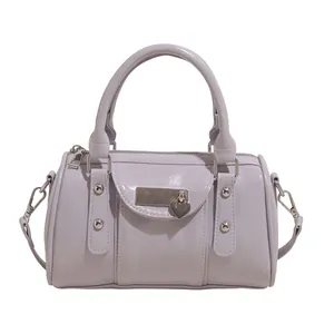 Lavender patent leather Boston bag with heart padlock and silver-tone hardware