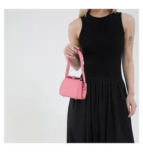 Detailed shot of pink pebble grain PU leather mini box bag with metallic eyelet handle