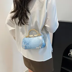Blue faux snake skin evening clutch bag with gold handle and chain strap for women