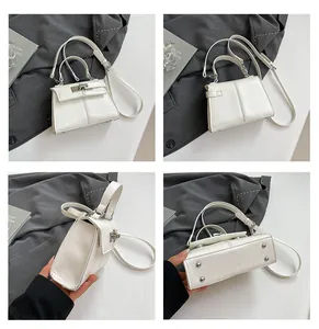 Detailed views of a white textured handbag with twist-lock and metal bottom studs