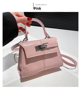 Close-up of pink PU leather handbag showing silver twist lock and fine stitching details