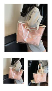 Detail of pink canvas inner pouch with IT CHICK letters inside transparent PVC tote bag