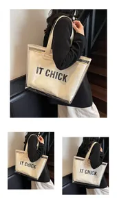 Detail view of transparent jelly tote with IT CHICK letter print and inner canvas pouch