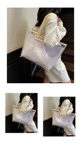 Detail view of large transparent jelly tote bag with IT CHICK logo and purple inner pouch