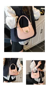 Macro view of pink woven hobo bag detailing the gold clasp and metallic chain strap