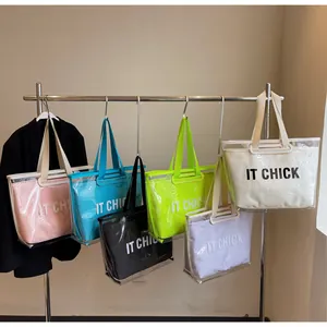 Detailed view of colorful transparent PVC tote bags with inner canvas pouches in six colors
