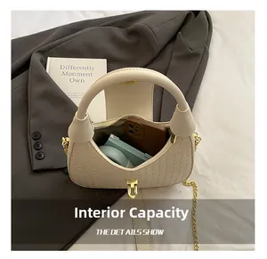 Detail shot of the beige woven handbag interior showing space for phone and makeup
