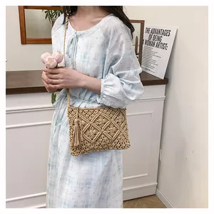 Detail of hand-woven cotton rope bag with tassel and textured diamond wheat patterns