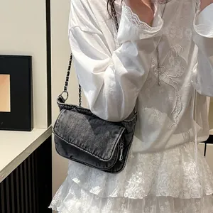 Vintage grey denim crossbody bag with pleated texture and silver metal chain strap