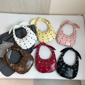 Chic studded half-moon handbags in six colors with grommet detail and knotted handle