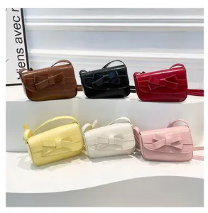 Mini crossbody bags with bow details in six colors like black, red, and yellow