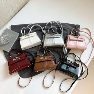 Elegant solid color tote bags with metal lock design and detachable straps in six colors