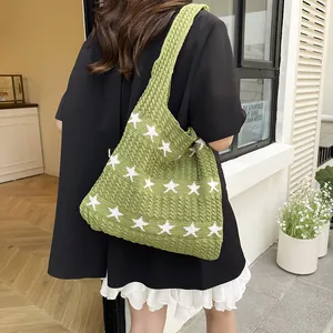 Green knitted star pattern shoulder tote bag with a wide strap for casual bohemian style