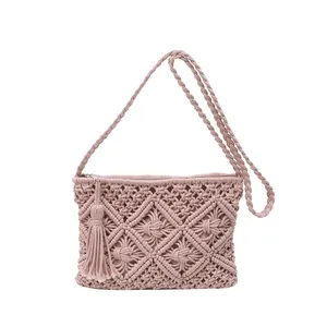 Pink cotton woven crossbody bag with bohemian tassel and diamond knit pattern