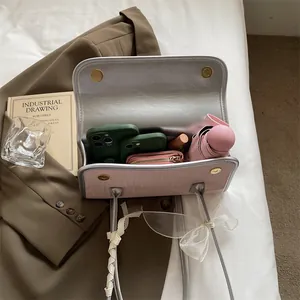 Pink wood texture shoulder bag with silk ribbon detail and spacious interior storage