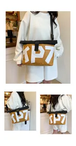 Detail showing the mustard yellow messenger bag with KP7 print and roll-top buckle closure