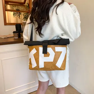 2025 trendy yellow canvas messenger bag with KP7 letter print and buckle closure