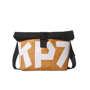Fashionable mustard yellow messenger bag with KP7 lettering and black buckle strap