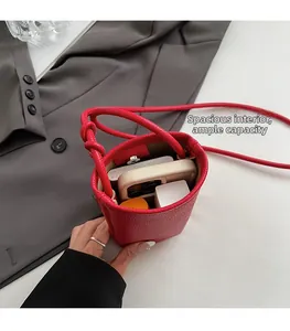 Interior view showing spacious capacity of the red pebble leather mini crossbody bag