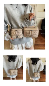 Detail of beige quilted crossbody bag with V-shaped texture and rose charm