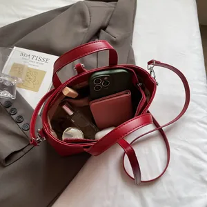Retro red crocodile texture tote bag with large capacity, shown with daily essentials