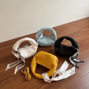 Litchi pattern dumpling bags in four colors with decorative silk scarves and straps