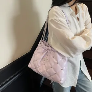 Chic light purple quilted chain bag with silver star studs and cloud pleat design