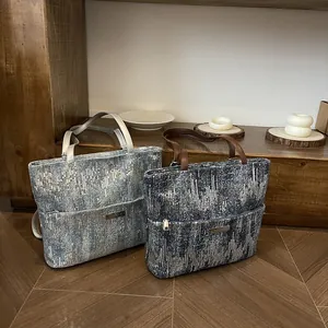 Chic tote bag with shimmering sequins and leather handles for stylish daily commuting