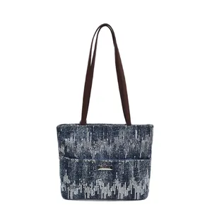 Navy blue large capacity tote bag with silver sequin pattern and brown shoulder straps