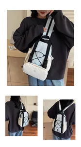 Detail showing multifunctional utility backpack with KMD 2ND logo and cord details