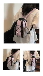 Detail of multi-functional lavender and grey mini backpack with drawstring and bungee cord