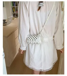 Detail of Korean style lace polka dot mini crossbody bag with delicate frill edge