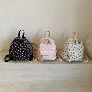 Quilted bow print backpacks in black, pink, and beige for students and girls daily use
