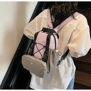 Rear view of model wearing a stylish purple and grey two-in-one sports backpack