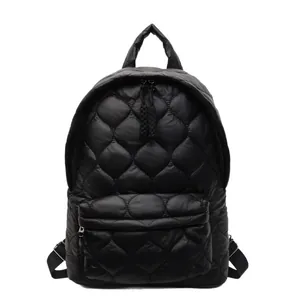 Minimalist black quilted backpack with large capacity and waterproof puffer texture