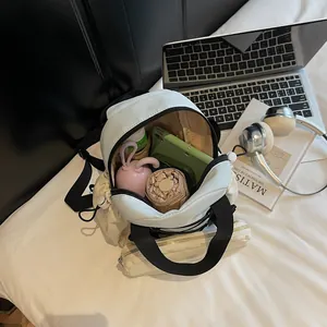 Fashionable beige multifunctional sports backpack with front pocket and side drawstring pocket