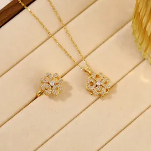 Close-up of elegant gold plated clover jewelry set with sparkling zircon in a velvet box