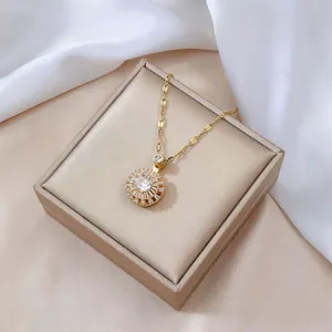 Close-up of a rotating flower pendant with sparkling zircon on a luxury jewelry box
