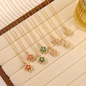 Elegant rotating zircon bauhinia flower pendant necklaces in multiple colors with gold chains