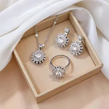 Elegant rotating sunburst necklace set with zircon flower pendant and silver tone metal
