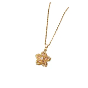 Golden flower necklace with rotating zircon petals and sparkling crystal pendant for women