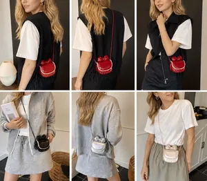 Detail showcasing the mini bow crossbody bag in red, black, silver, and pink variants