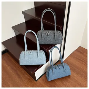 Detailed comparison of denim Boston bags in dark grey, light grey, and blue colors
