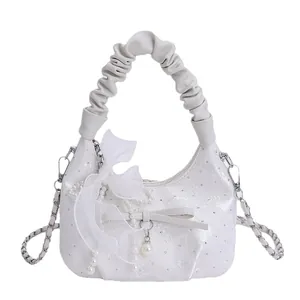 White ruched handle handbag with lace bow pearl chain and glitter diamond detailing