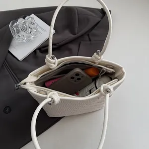 White woven tote bag with spacious interior for phone, wallet, and daily essentials