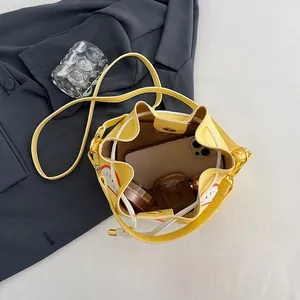 Bright yellow leather bucket bag with drawstring closure and spacious interior storage